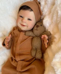 newborn baby doll Sebastian in brown dress